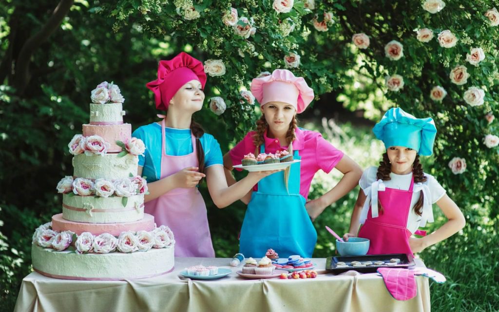 Children confectioners selling cake outside